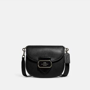 Coach “Morgan” Saddle Bag. Black pebble leather with snake detailing.